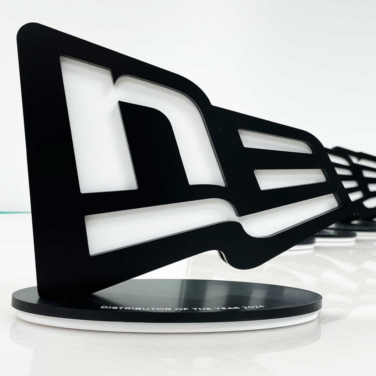 New Balance bespoke awards in shape of logo