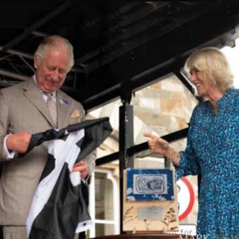 King Charles and Qeen Camilla unveiling bespoke award made by More Awards